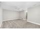 Bright and airy bedroom features neutral walls, carpet, and a ceiling fan at 795 Sugar Cane Ln, Port Orange, FL 32129