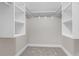 Bright walk-in closet offers custom built-in shelving and ample storage space at 795 Sugar Cane Ln, Port Orange, FL 32129