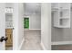 Hallway view leading to a bright bedroom and bathroom with new cabinets and fixtures at 795 Sugar Cane Ln, Port Orange, FL 32129