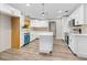 Bright, updated kitchen with white cabinetry, stainless steel appliances, and a central island at 795 Sugar Cane Ln, Port Orange, FL 32129