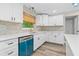 Modern kitchen featuring white cabinets, stone countertops, stainless appliances, and designer backsplash at 795 Sugar Cane Ln, Port Orange, FL 32129