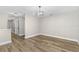 Bright room with wood-look floors and fresh neutral paint at 795 Sugar Cane Ln, Port Orange, FL 32129