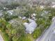 Expansive property with charming home, garage, and storage building all within a tree-lined and private lot at 801 Canal St, New Smyrna Beach, FL 32168