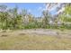 Spacious backyard featuring young trees and ample space for outdoor activities at 801 Canal St, New Smyrna Beach, FL 32168