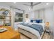 Calm and inviting bedroom featuring coastal decor, light blue accents, and plenty of natural light at 801 Canal St, New Smyrna Beach, FL 32168