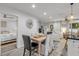 Charming dining area adjacent to a cozy seating area and a bedroom for convenient living and entertaining at 801 Canal St, New Smyrna Beach, FL 32168