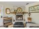 Stone fireplace with wood mantel and decorative accents in the living room at 801 Canal St, New Smyrna Beach, FL 32168
