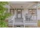 Inviting front porch with rocking chairs, offering a relaxing outdoor space at 801 Canal St, New Smyrna Beach, FL 32168