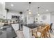 Updated kitchen features stainless steel appliances, island, and an open design into the dining and living area at 801 Canal St, New Smyrna Beach, FL 32168