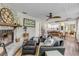 Cozy living room with stone fireplace, wood floors, and decorative ceiling at 801 Canal St, New Smyrna Beach, FL 32168