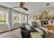 Comfortable living room with stone fireplace, wood floors, and natural light at 801 Canal St, New Smyrna Beach, FL 32168