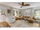 Inviting living room with wood floors, comfortable seating, and windows allowing natural light at 801 Canal St, New Smyrna Beach, FL 32168