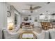 Comfortable living room with natural lighting, coastal decor, and an open layout connecting the kitchen at 801 Canal St, New Smyrna Beach, FL 32168