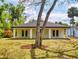 View of backyard of home with a large tree at 808 Rosalia Dr, Sanford, FL 32771