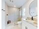 Modern bathroom featuring a glass shower, sleek fixtures, and a round mirror at 808 Rosalia Dr, Sanford, FL 32771