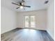 Bedroom featuring a ceiling fan and double doors leading to the outdoors at 808 Rosalia Dr, Sanford, FL 32771