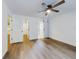 Bright bedroom features sliding barn door, ceiling fan, and ensuite bathroom at 808 Rosalia Dr, Sanford, FL 32771