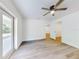 Bedroom featuring French doors, ceiling fan, and light-colored floors at 808 Rosalia Dr, Sanford, FL 32771