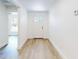 Bright hallway featuring a decorative front door and neutral walls at 808 Rosalia Dr, Sanford, FL 32771