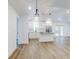 Bright, open-concept kitchen with island, stainless appliances and modern white cabinetry at 808 Rosalia Dr, Sanford, FL 32771