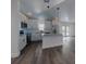 Modern kitchen with white cabinets, granite countertops, and stainless steel appliances at 808 Rosalia Dr, Sanford, FL 32771