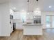 New kitchen features white cabinetry, stainless appliances, an island, granite countertops, and lots of light at 808 Rosalia Dr, Sanford, FL 32771