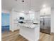 Open concept kitchen with stainless steel appliances and a marble-topped island at 808 Rosalia Dr, Sanford, FL 32771