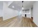 Open living area with hardwood floors, custom shelving, mini fridge, and recessed lighting at 808 Rosalia Dr, Sanford, FL 32771