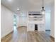 Spacious living room with hardwood floors, custom shelving, mini fridge, and recessed lighting at 808 Rosalia Dr, Sanford, FL 32771