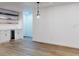 Open living area with hardwood floors, custom shelving, mini fridge, and recessed lighting at 808 Rosalia Dr, Sanford, FL 32771