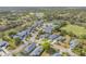 Neighborhood aerial view showcasing the golf course and a serene lake at 1100 Loch Linnhe Ct, New Smyrna Beach, FL 32168