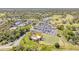 Aerial view of a golf course and parking lot on a sunny day at 1100 Loch Linnhe Ct, New Smyrna Beach, FL 32168