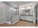 Bright bathroom featuring a large walk-in shower and double vanity sinks at 1100 Loch Linnhe Ct, New Smyrna Beach, FL 32168