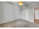 Bedroom with statement wall paneling and large closet at 1100 Loch Linnhe Ct, New Smyrna Beach, FL 32168