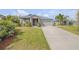 Charming single-story home with well-manicured lawn, landscaping, and a two-car garage at 1100 Loch Linnhe Ct, New Smyrna Beach, FL 32168