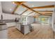 Spacious kitchen with granite island, stainless appliances, and access to the backyard at 1100 Loch Linnhe Ct, New Smyrna Beach, FL 32168