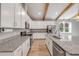 Modern kitchen features granite countertops, stainless steel appliances, and a breakfast bar at 1100 Loch Linnhe Ct, New Smyrna Beach, FL 32168