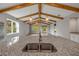 Open kitchen with granite counters, stainless sink, and wooden beams, offering a modern design at 1100 Loch Linnhe Ct, New Smyrna Beach, FL 32168