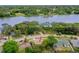 Aerial view of home near a lake, showcasing its location surrounded by trees and waterfront at 1364 W Hartley Cir, Deltona, FL 32725