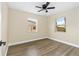 Bedroom featuring vinyl floors, ceiling fan, and bright windows at 1364 W Hartley Cir, Deltona, FL 32725