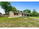 Charming single-story home with a well-maintained front yard, and a long driveway at 1364 W Hartley Cir, Deltona, FL 32725