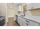 Bright kitchen featuring stainless steel appliances and modern cabinetry at 1364 W Hartley Cir, Deltona, FL 32725