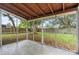 Enclosed screened in porch overlooks the spacious backyard at 1364 W Hartley Cir, Deltona, FL 32725