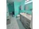 Bright bathroom featuring new vanity with marble countertop and tiled floor at 2530 Tamarind Dr, Edgewater, FL 32141
