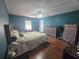 Comfortable bedroom boasts hardwood floors and a ceiling fan at 2530 Tamarind Dr, Edgewater, FL 32141