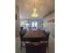 Bright dining room with large table, a decorative chandelier, and kitchen access at 2530 Tamarind Dr, Edgewater, FL 32141