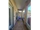 Covered entryway with tiled flooring, seating, and partial view of the home's exterior at 2530 Tamarind Dr, Edgewater, FL 32141