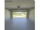 Spacious garage with an open door showcasing the home's curb appeal at 2530 Tamarind Dr, Edgewater, FL 32141