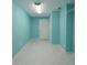 Spacious hallway featuring tile floors, neutral walls, and two doors at 2530 Tamarind Dr, Edgewater, FL 32141
