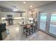 Bright kitchen featuring white cabinets, stainless steel appliances, and a breakfast bar at 2530 Tamarind Dr, Edgewater, FL 32141